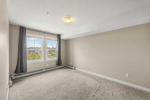 212-2300 Evanston Square Nw, Calgary, AB - Indoor Photo Showing Other Room