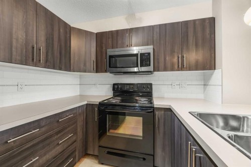 212-2300 Evanston Square Nw, Calgary, AB - Indoor Photo Showing Kitchen