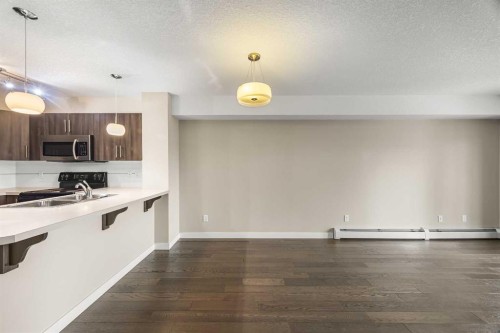 212-2300 Evanston Square Nw, Calgary, AB - Indoor Photo Showing Kitchen With Double Sink