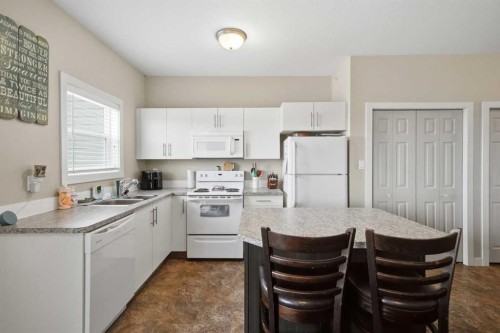 3430 49 Avenue, Red Deer, AB - Indoor Photo Showing Kitchen With Double Sink