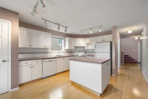 256 Harvest Glen Place Ne, Calgary, AB - Indoor Photo Showing Kitchen With Double Sink