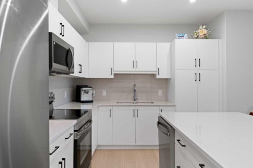 1112-81 Arbour Lake View Nw, Calgary, AB - Indoor Photo Showing Kitchen With Double Sink