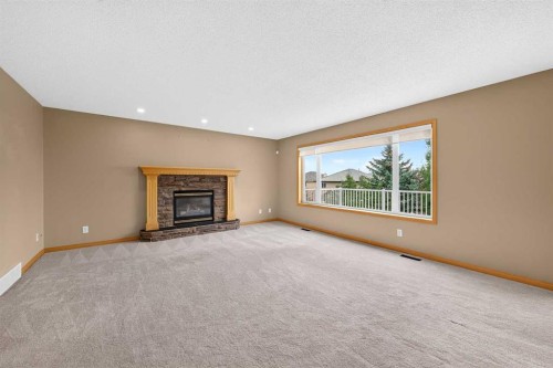 78 Hampstead View Nw, Calgary, AB - Indoor Photo Showing Living Room With Fireplace