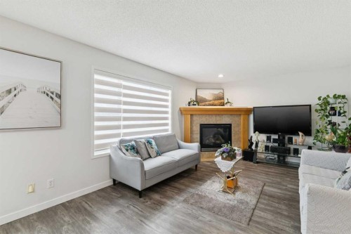 126 Somerglen Way Sw, Calgary, AB - Indoor Photo Showing Living Room With Fireplace
