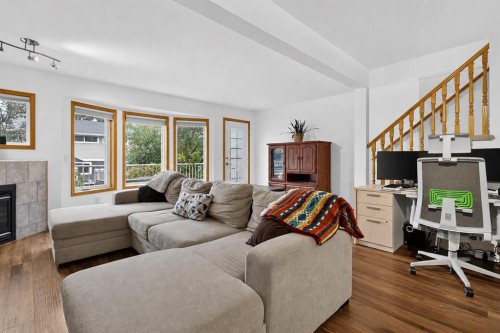 592 Regal Park Ne, Calgary, AB - Indoor Photo Showing Living Room With Fireplace