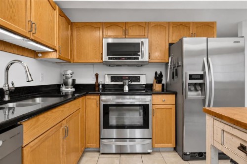 592 Regal Park Ne, Calgary, AB - Indoor Photo Showing Kitchen With Stainless Steel Kitchen With Double Sink