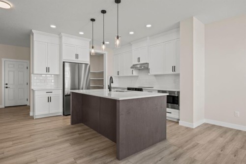 435 Kinniburgh Loop, Chestermere, AB - Indoor Photo Showing Kitchen With Stainless Steel Kitchen With Upgraded Kitchen