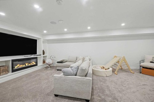 2615 Lougheed Drive Sw, Calgary, AB - Indoor With Fireplace