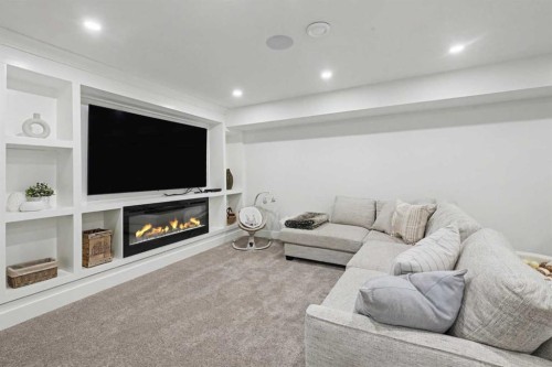 2615 Lougheed Drive Sw, Calgary, AB - Indoor Photo Showing Living Room With Fireplace