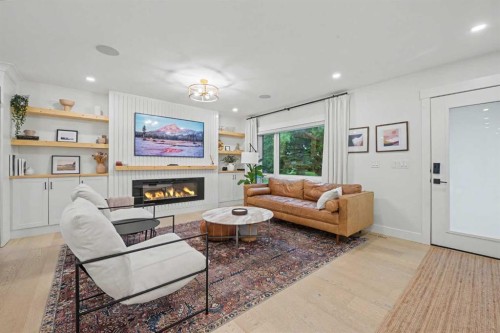 2615 Lougheed Drive Sw, Calgary, AB - Indoor Photo Showing Living Room With Fireplace