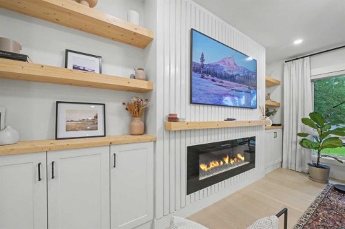 2615 Lougheed Drive Sw, Calgary, AB - Indoor Photo Showing Other Room With Fireplace