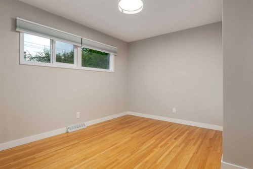 30 Hutton Place Sw, Calgary, AB - Indoor Photo Showing Other Room