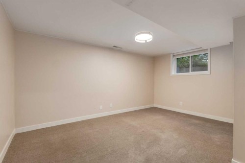 30 Hutton Place Sw, Calgary, AB - Indoor Photo Showing Other Room