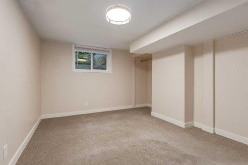 30 Hutton Place Sw, Calgary, AB - Indoor Photo Showing Other Room