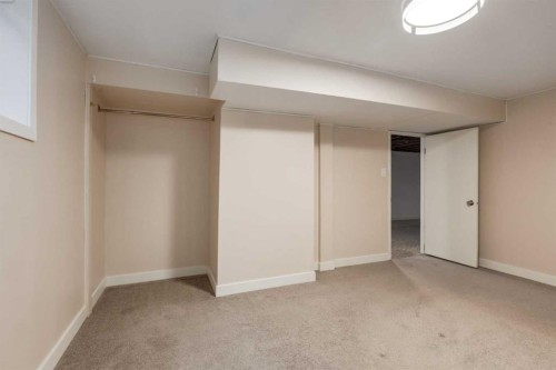 30 Hutton Place Sw, Calgary, AB - Indoor Photo Showing Other Room
