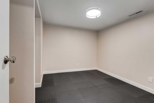 30 Hutton Place Sw, Calgary, AB - Indoor Photo Showing Other Room