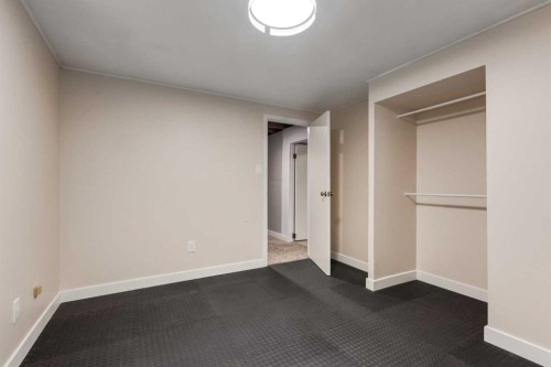 30 Hutton Place Sw, Calgary, AB - Indoor Photo Showing Other Room