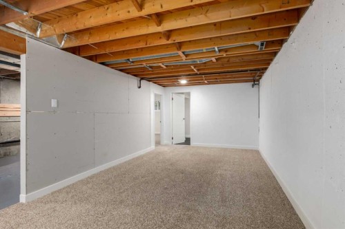 30 Hutton Place Sw, Calgary, AB - Indoor Photo Showing Basement