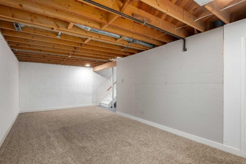 30 Hutton Place Sw, Calgary, AB - Indoor Photo Showing Basement