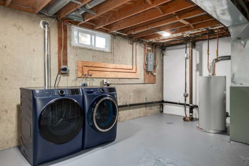 30 Hutton Place Sw, Calgary, AB - Indoor Photo Showing Laundry Room