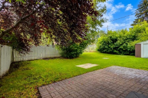 30 Hutton Place Sw, Calgary, AB - Outdoor With Backyard