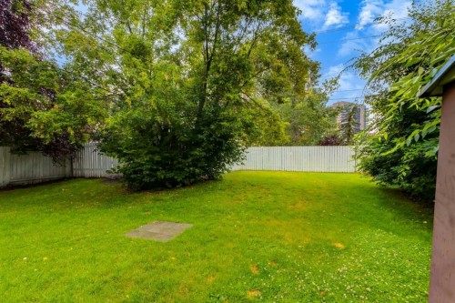 30 Hutton Place Sw, Calgary, AB - Outdoor With Backyard