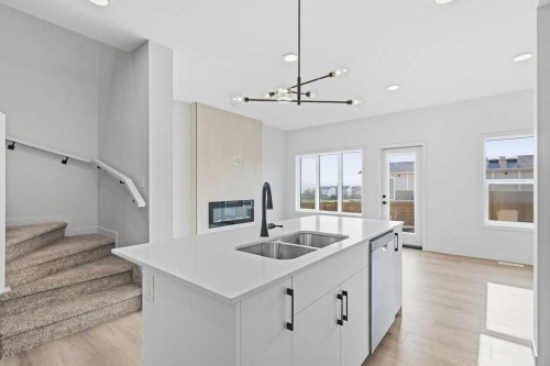 30 Heritage Heath, Cochrane, AB - Indoor Photo Showing Kitchen With Double Sink