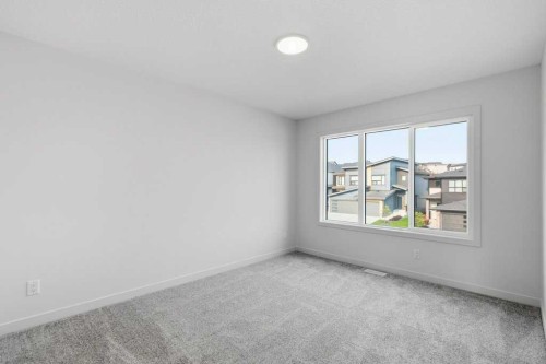 30 Heritage Heath, Cochrane, AB - Indoor Photo Showing Other Room