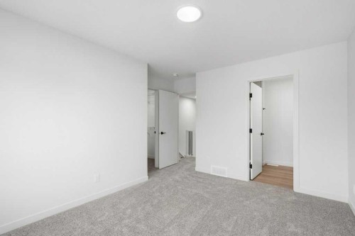30 Heritage Heath, Cochrane, AB - Indoor Photo Showing Other Room