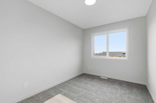 30 Heritage Heath, Cochrane, AB - Indoor Photo Showing Other Room