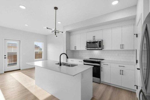30 Heritage Heath, Cochrane, AB - Indoor Photo Showing Kitchen With Upgraded Kitchen