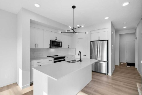 30 Heritage Heath, Cochrane, AB - Indoor Photo Showing Kitchen With Double Sink With Upgraded Kitchen