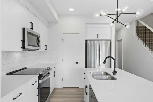 30 Heritage Heath, Cochrane, AB - Indoor Photo Showing Kitchen With Double Sink With Upgraded Kitchen