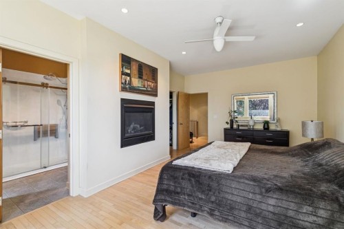 1717 7 Avenue Nw, Calgary, AB - Indoor Photo Showing Bedroom With Fireplace