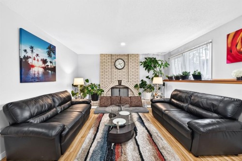 1008 Cantabrian Drive Sw, Calgary, AB - Indoor Photo Showing Living Room