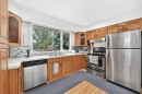 1008 Cantabrian Drive Sw, Calgary, AB  - Indoor Photo Showing Kitchen With Stainless Steel Kitchen With Double Sink 