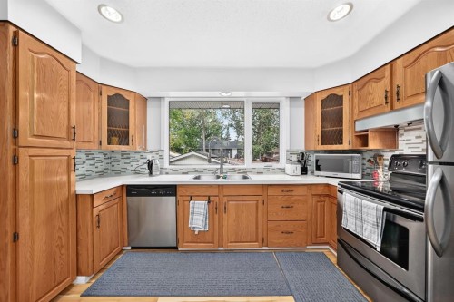 1008 Cantabrian Drive Sw, Calgary, AB - Indoor Photo Showing Kitchen With Stainless Steel Kitchen With Double Sink