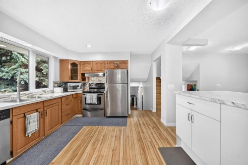 1008 Cantabrian Drive Sw, Calgary, AB - Indoor Photo Showing Kitchen With Stainless Steel Kitchen
