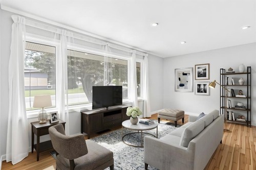 1008 Cantabrian Drive Sw, Calgary, AB - Indoor Photo Showing Living Room