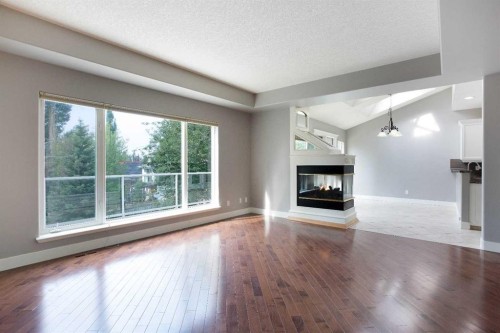 3414 Douglasdale Boulevard Se, Calgary, AB - Indoor Photo Showing Living Room With Fireplace