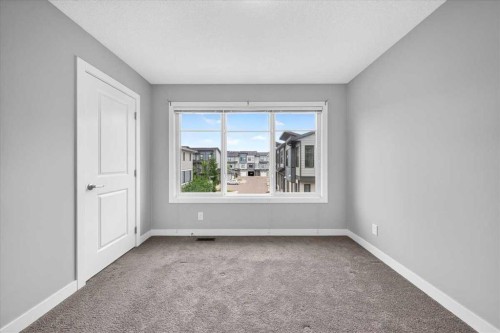 154 Seton Passage Se, Calgary, AB - Indoor Photo Showing Other Room