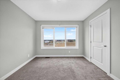154 Seton Passage Se, Calgary, AB - Indoor Photo Showing Other Room