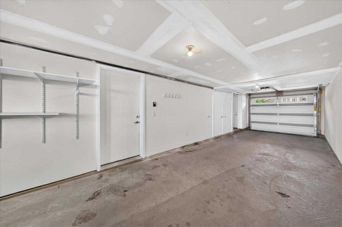 154 Seton Passage Se, Calgary, AB - Indoor Photo Showing Garage