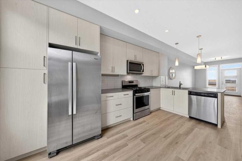 154 Seton Passage Se, Calgary, AB - Indoor Photo Showing Kitchen With Upgraded Kitchen