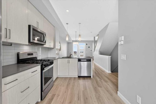 154 Seton Passage Se, Calgary, AB - Indoor Photo Showing Kitchen With Upgraded Kitchen