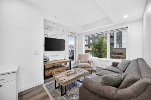 207-3450 19 Street Sw, Calgary, AB - Indoor Photo Showing Living Room