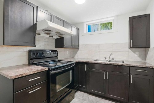 1211 Maitland Drive Ne, Calgary, AB - Indoor Photo Showing Kitchen With Double Sink