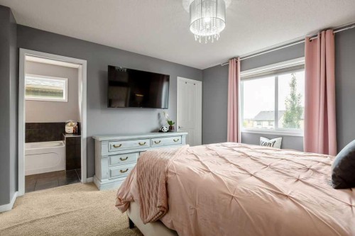 81 New Brighton Heights Se, Calgary, AB - Indoor Photo Showing Bedroom