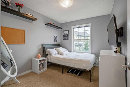 81 New Brighton Heights Se, Calgary, AB - Indoor Photo Showing Bedroom
