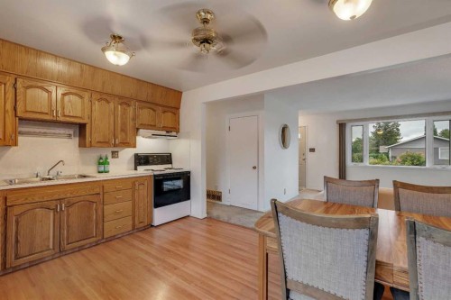 219 Tache Avenue Nw, Calgary, AB - Indoor Photo Showing Kitchen With Double Sink